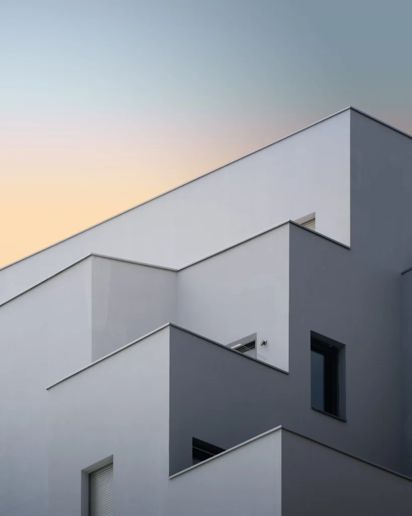 Vertical Low Angle Shot White Concrete Building Scaled 1 | PROMOMARME SL